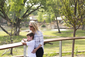 Mom and son looking at elephants