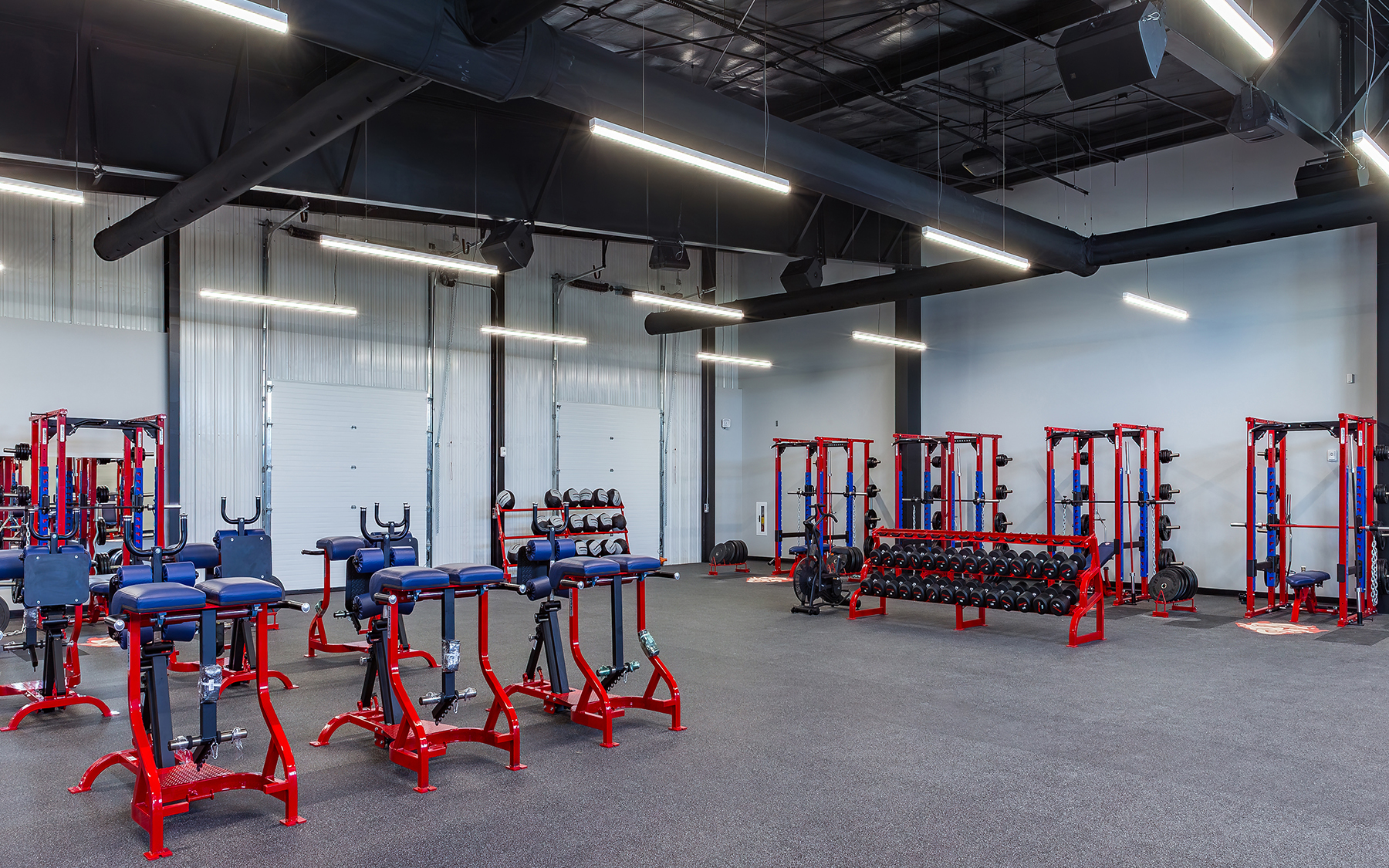Dodge City High School weight room with doors.